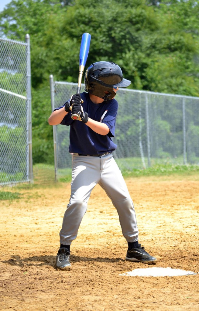 a young baseball playre ready to bat